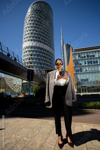 Businesswoman stands in fro...