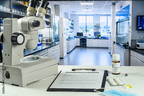 Photos Microscope and PCR report in antiviral research laboratory