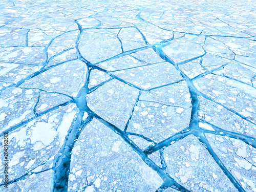 Fractured Arctic Ice Sheet Aerial Texture — Blue and White Geometric Pattern