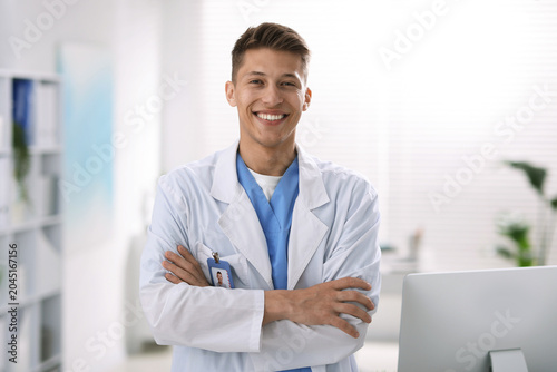 Fotografi Portrait of medical assistant in white coat at clinic