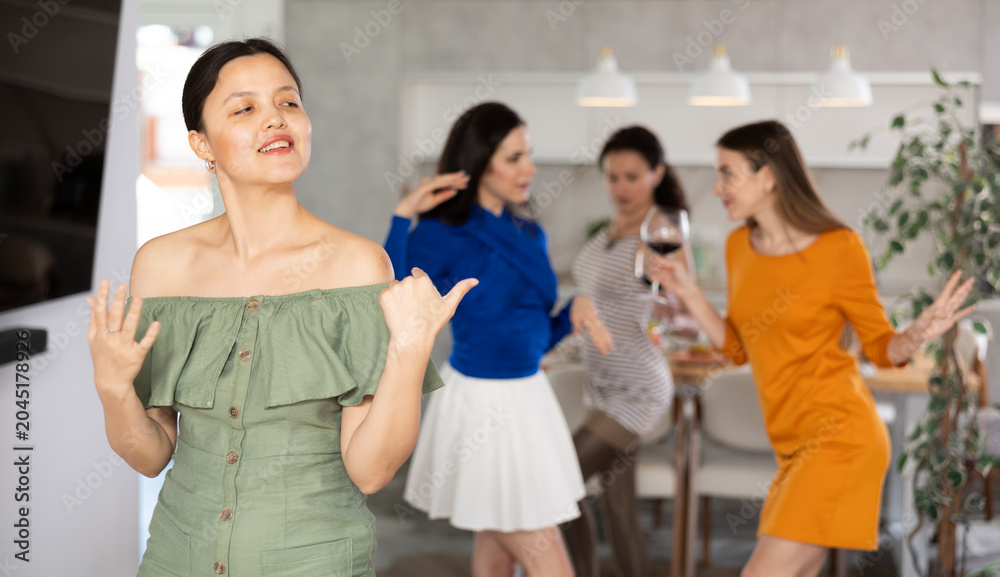 Fototapeta premium Happy women dancing at a bachelorette party - girlfriends home party