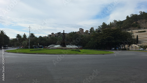 Fényképezés Plaza del General Torrijos with Fountain of the Three Graces and Alcazaba in Mal
