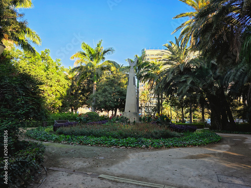 Lush Tropical Garden with The Monument to Salvador Rueda in Malaga Park - Malaga, Spain