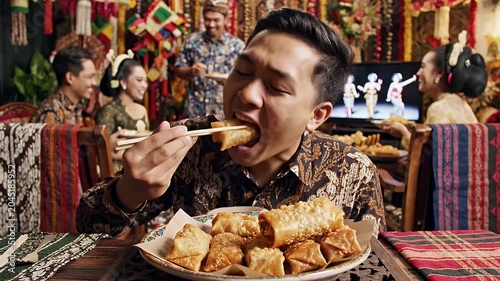 Man eating spring roll.