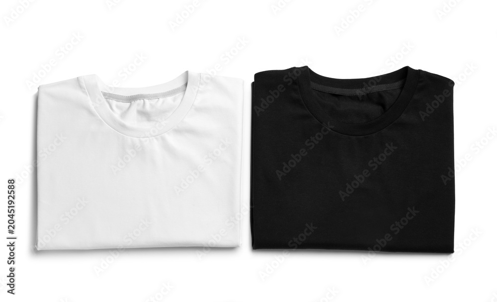 Naklejka premium Folded t-shirts isolated on white, top view