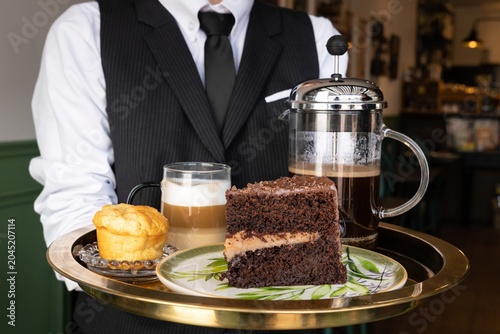 Elegant Coffee Service with Chocolate Cake and Dessert Tray