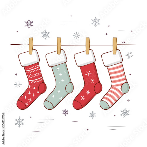 Four Christmas stockings hanging on a line with snowflakes