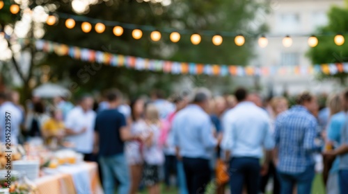 Crowd mingling at outdoor evening garden party with lights
