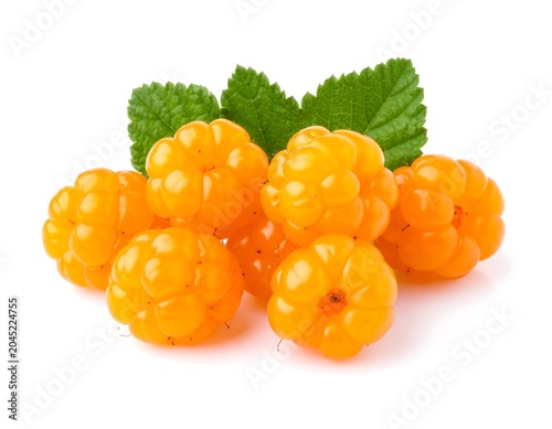 Fresh cloudberries in a white background, white bowl with, green leaves
