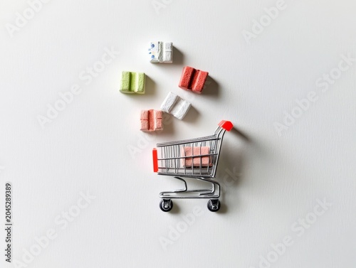 A delightful miniature shopping cart filled with pastel-colored packages.