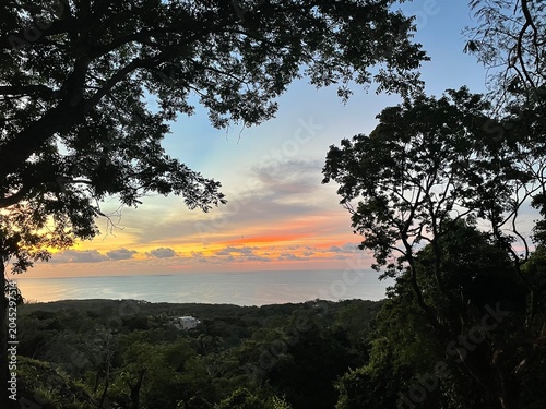 Schilderij op canvas Roatán Sunset Aerial View Over Coastal Line and Caribbean Sea