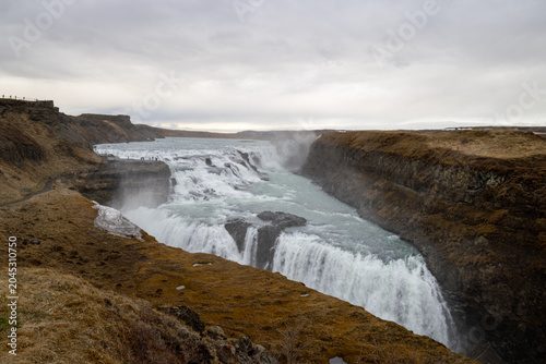 Obraz na płótnie Gullfoss waterfall plunging in two tiers into a deep river canyon on the Golden