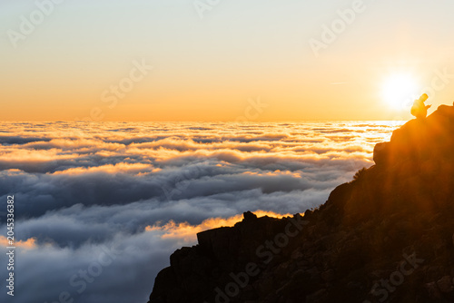 Bild auf Leinwand Silhouette on Mountain Peak Above Clouds, Golden Sunset Sky, Serene Landscape, D
