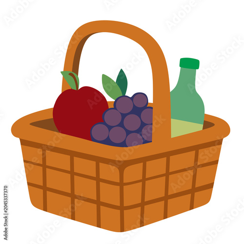 Warm wicker basket holds fresh fruit and green bottle