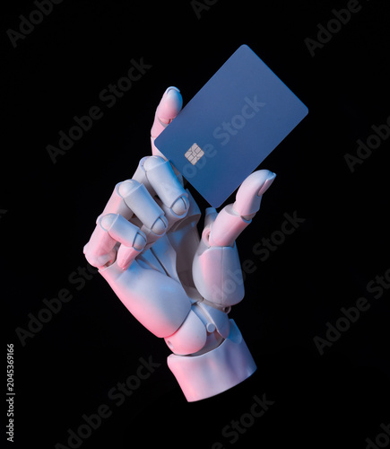 Quadro su tela Robotic hand holding blue credit card with neon lighting on black background