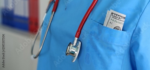 Doctor putting dollar bill in his coat pocket 4k movie slow motion.