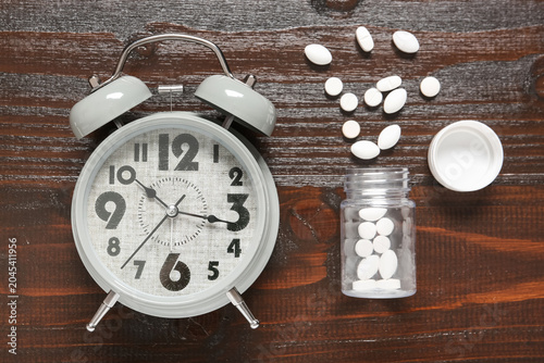 Alarm clock and jar with wh...