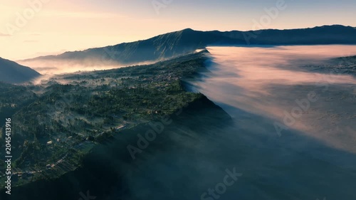Aerial view of the area surrounding Mount Bromo (Gunung Bromo) during sunrise in Bromo Tengger Semeru National Park, East Java, Indonesia.