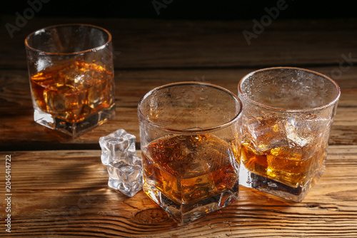 Glasses of cold whiskey on ...