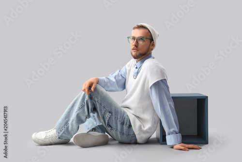 Stylish young man in eyegla...