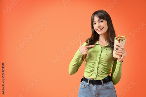 Young woman pointing at tas...