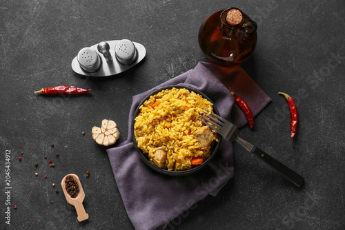 Bowl of tasty pilaf with ch...