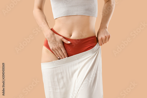 Young woman in red menstrua...