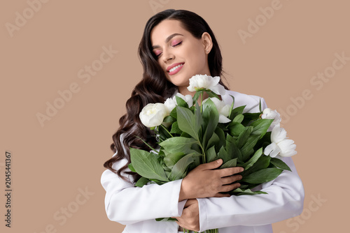Happy young woman with bouq...