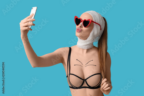 Young woman in sunglasses w...