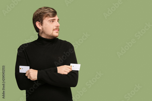 Young man with credit cards...