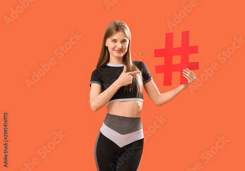 Sporty female coach pointin...