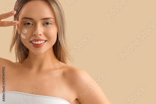 Pretty young woman with cre...