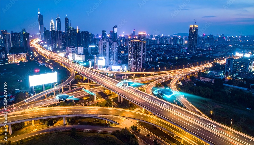 Fototapeta premium Futuristic City Skyline at Night with Elevated Highway Interchanges and Flying Vehicles