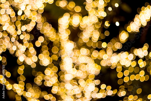 dense golden bokeh light circles filling the frame. luxury warm abstract background for celebration and luxury concepts