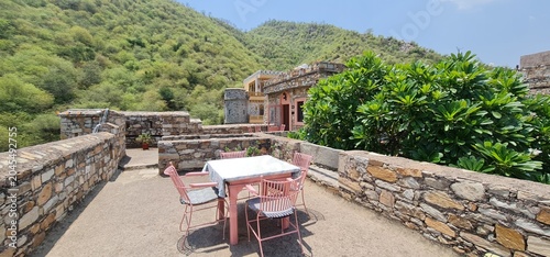Outdoor Rooftop Sitting Area with Table and Chairs at the Historic Dadhikar Fort in Alwar Rajasthan India