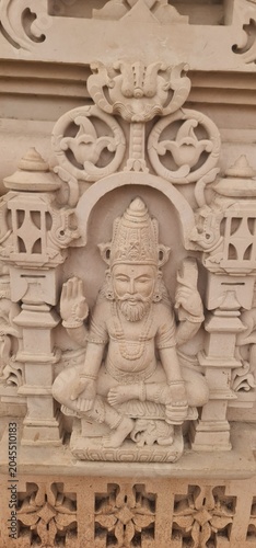 Intricate Traditional Indian Carvings and Religious Relief Designs on Sandstone wall at Heritage Corridor in Ujjain, Madhya Pradesh, India 