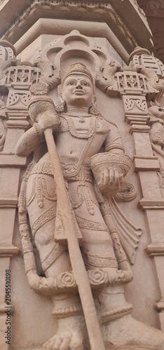 Intricate Traditional Indian Carvings and Religious Relief Designs on Sandstone wall at Heritage Corridor in Ujjain, Madhya Pradesh, India 