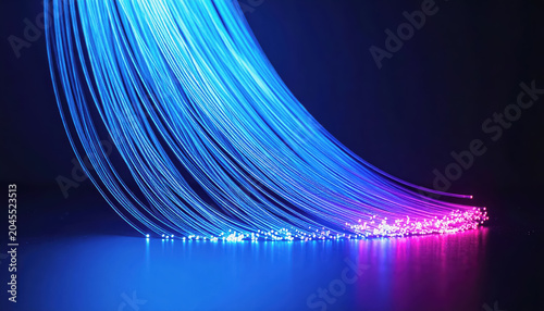 Abstract of blue and purple fiber optic strands with glowing light particles on a dark surface