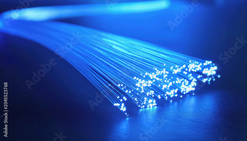 Fiber Optic Cable Emitting Pink and Blue Light Streaks and Particles