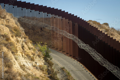Bild auf Leinwand Looking down at the international boarder wall from Tijuana Mexico