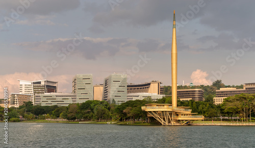 Tableau sur toile Golden Millennium Monument and modern buildings along Putrajaya Lake, Putrajaya,