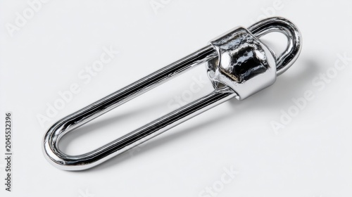 Shiny metal fishing swivel clip isolated on white background for fishing tackle and gear