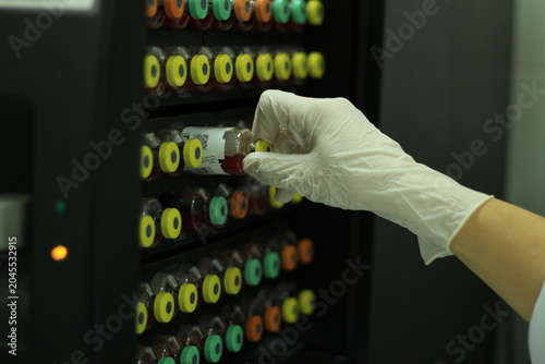 Obraz na płótnie Clinical Laboratory Technician Processing Blood Samples and Microbiological Spec