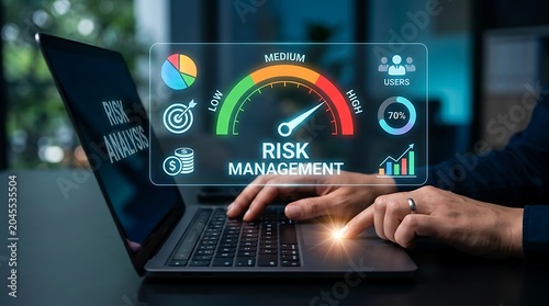 Business professional analyzing risk management dashboard on laptop in modern office