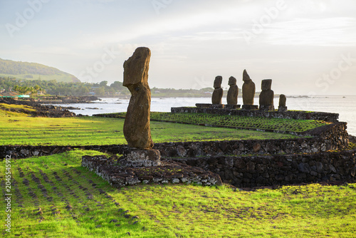 Slika na platnu Peaceful ancient moai stone statue faces ocean on easter island chile