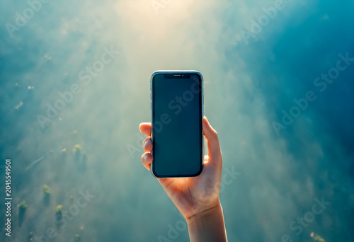 Girl using mobile phone texting on smartphone