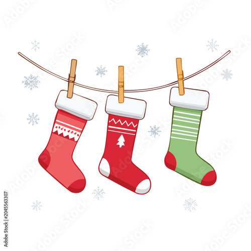 Three Christmas stockings hanging on a line with snowflakes