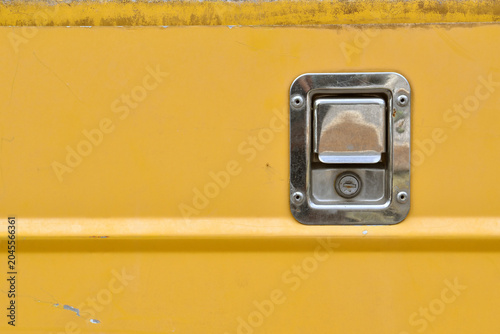 silver stainless paddle latch lock with keyhole on metallic panel with copy space