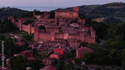 Aerial panorama of the romantic travel destination Castello di Gradara in warm evening light