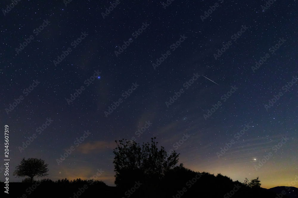 Obraz premium Constellations, landscape, Milky Way stars on a dark countryside skies.